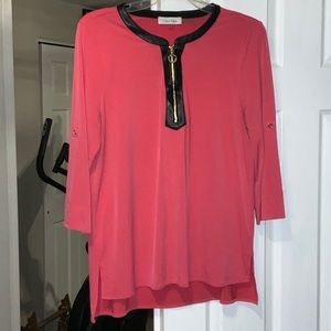 Coral 3/4 sleeve top with faux leather neck line.